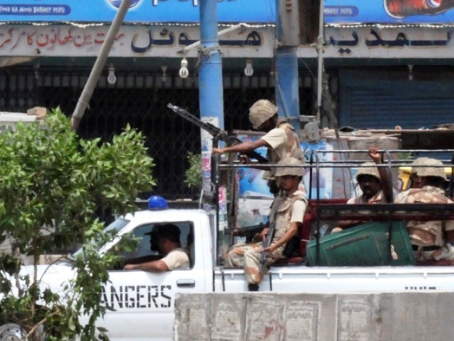Pakistani paramilitary soldiers patrol the streets