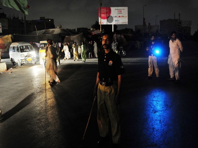 Policemen Stand on Karachi Intence Rad Area