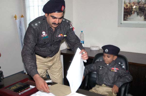 A 13-year old boy Azeem Ahmed, suffering from a contagious disease, performs duty as SHO Durakhshan police station following implementation of his wish under 'Make a Wish'