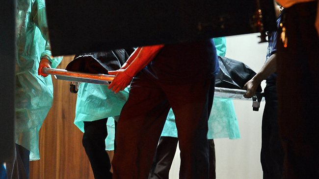 Hospital staff carry the body of the Indian gang-rape victim to the police morgue vehicle at the Mount Elizabeth hospital in Singapore. Picture: AFP/Rosland Rahman