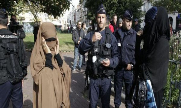 Violence erupts in France over police check of veiled Muslim woman